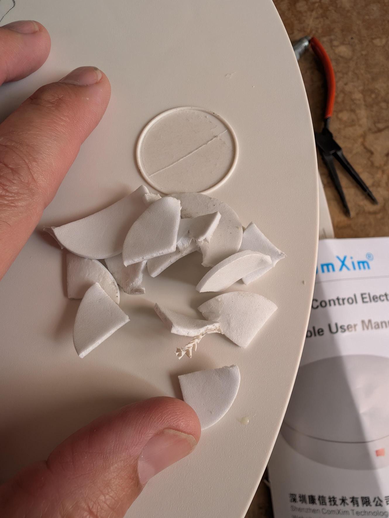 June 23: Foam pads removed reveal no fasteners underneath. The ComXim user manual is visible at right.